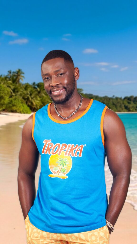 Tropika Wiseman Mncube – Actor, looking thoughtful and strategic, with a composed and observant demeanor.