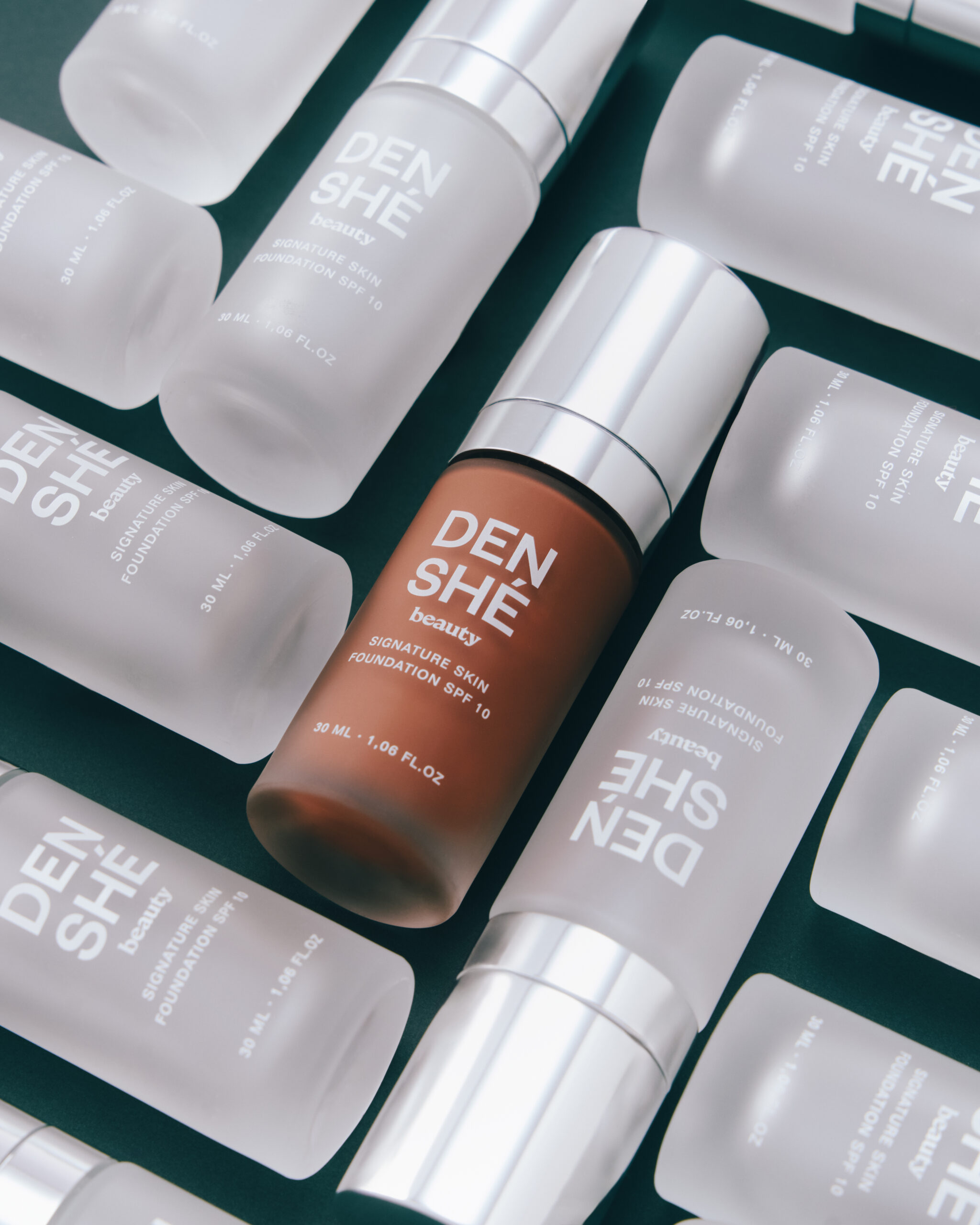 The Denshé Beauty Signature Skin Foundation in a frosted glass bottle with an aluminium coated pump
